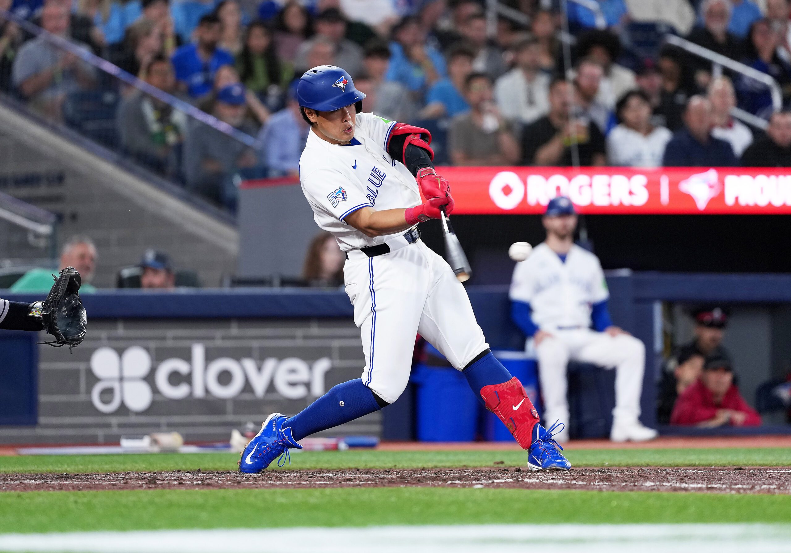 Jun 22, 2026; Toronto, Ontario, CAN; Toronto Blue Jays third baseman Kazuma Okamoto (7) hits a double against the Houston Astros during the seventh inning at Rogers Centre. Mandatory Credit: Nick Turchiaro-Imagn Images