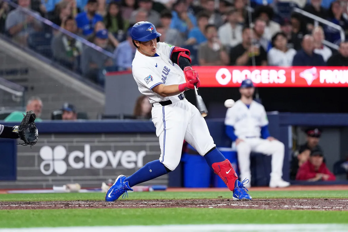 Jun 22, 2026; Toronto, Ontario, CAN; Toronto Blue Jays third baseman Kazuma Okamoto (7) hits a double against the Houston Astros during the seventh inning at Rogers Centre. Mandatory Credit: Nick Turchiaro-Imagn Images
