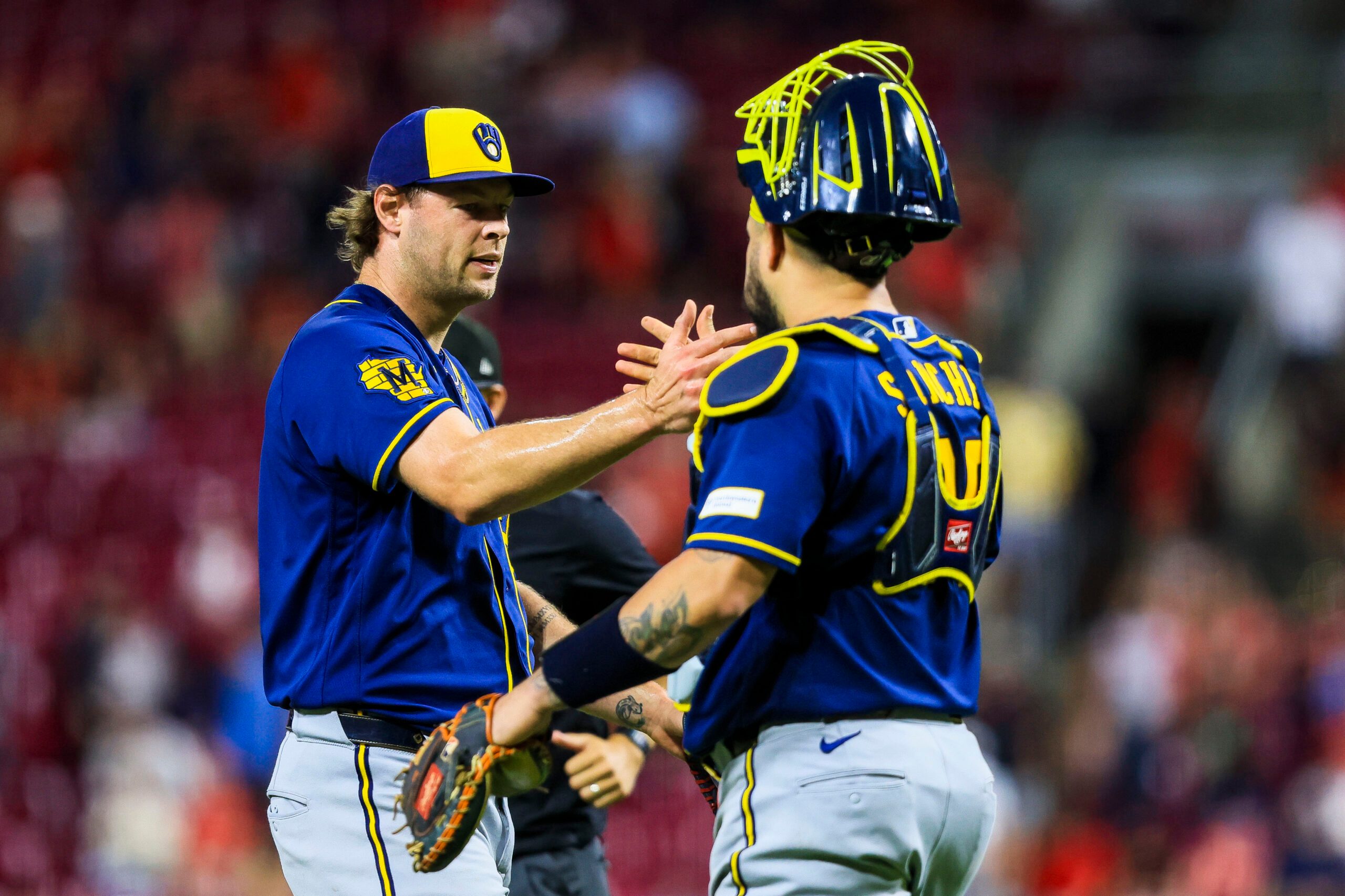 Jun 23, 2026; Cincinnati, Ohio, USA; Milwaukee Brewers relief pitcher Trevor Megill (29) shakes hands with catcher Gary Sanchez (99) after the victory over the Cincinnati Reds at Great American Ball Park. Mandatory Credit: Katie Stratman-Imagn Images