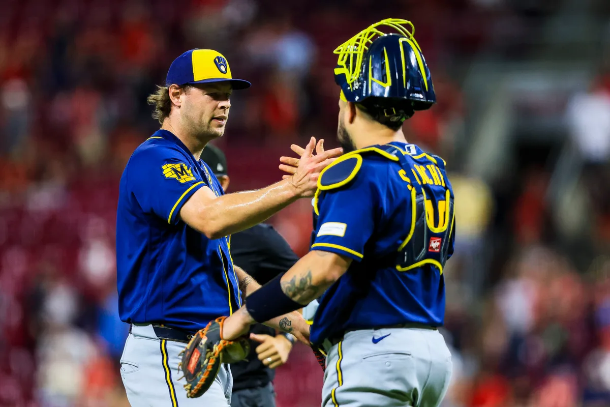 Jun 23, 2026; Cincinnati, Ohio, USA; Milwaukee Brewers relief pitcher Trevor Megill (29) shakes hands with catcher Gary Sanchez (99) after the victory over the Cincinnati Reds at Great American Ball Park. Mandatory Credit: Katie Stratman-Imagn Images