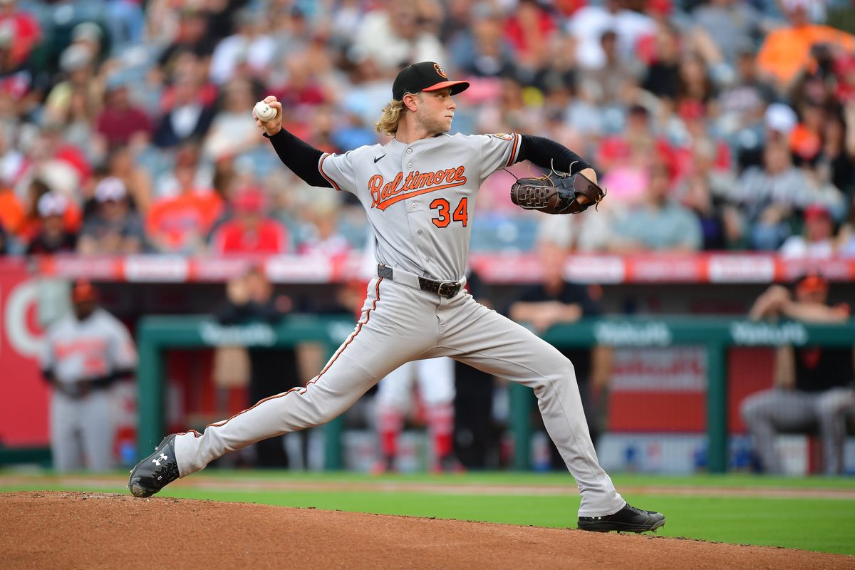 Jun 23, 2026; Anaheim, California, USA; Baltimore Orioles pitcher Shane Baz (34) throws against the Los Angeles Angels during the first inning at Angel Stadium. Mandatory Credit: Gary A. Vasquez-Imagn Images