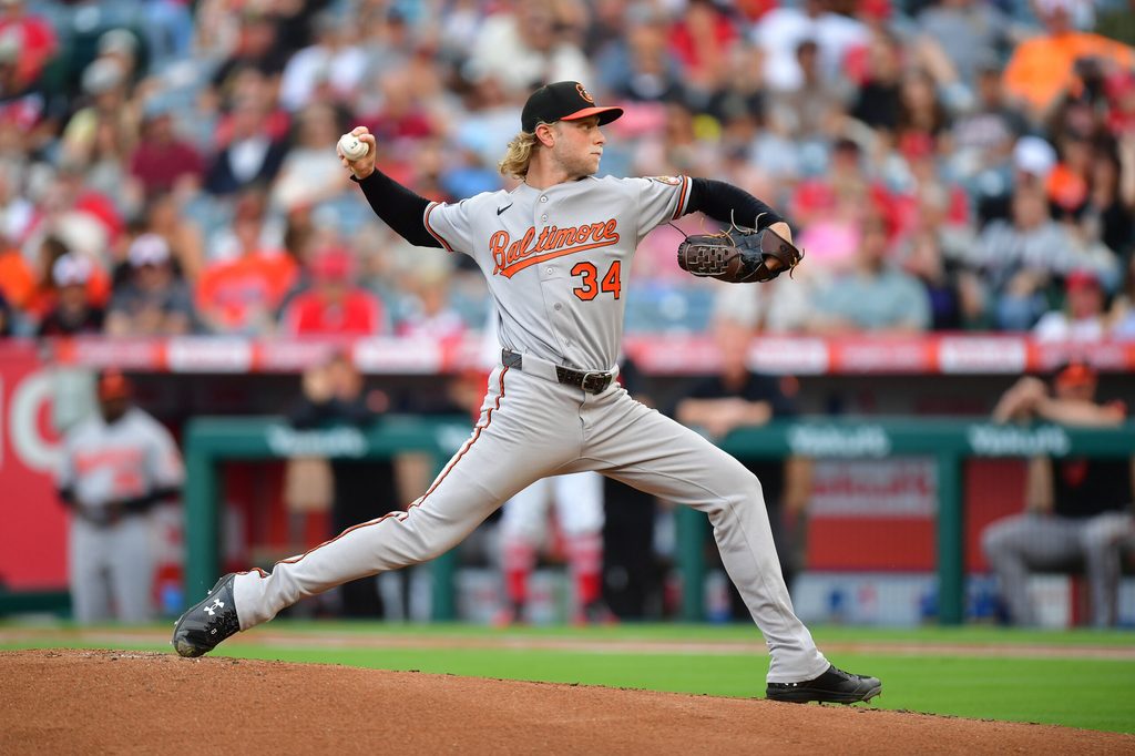 Jun 23, 2026; Anaheim, California, USA; Baltimore Orioles pitcher Shane Baz (34) throws against the Los Angeles Angels during the first inning at Angel Stadium. Mandatory Credit: Gary A. Vasquez-Imagn Images