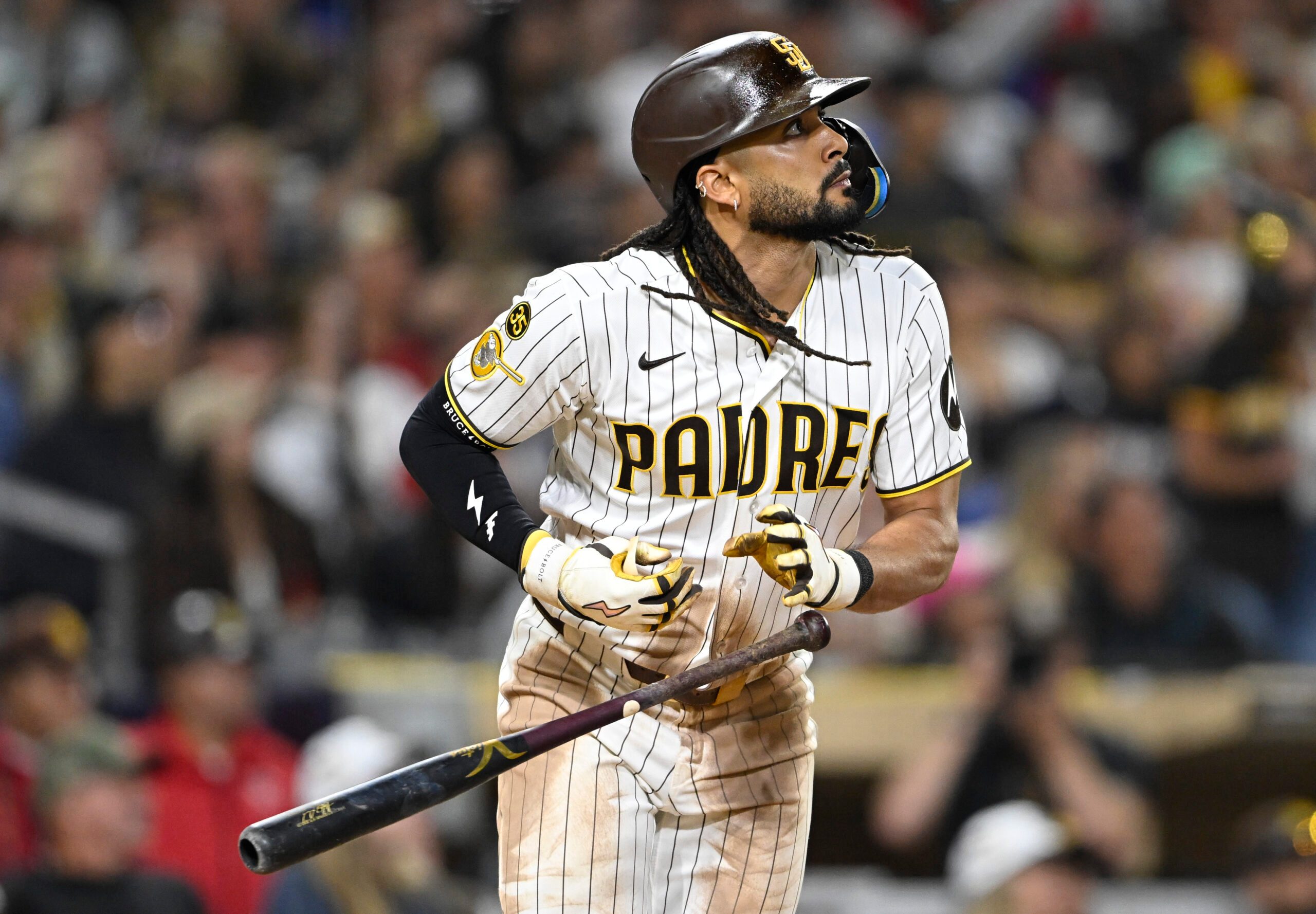 Jun 23, 2026; San Diego, California, USA; San Diego Padres right fielder Fernando Tatis Jr. (23) hits a solo home run during the seventh inning against the Atlanta Braves at Petco Park. Mandatory Credit: Denis Poroy-Imagn Images