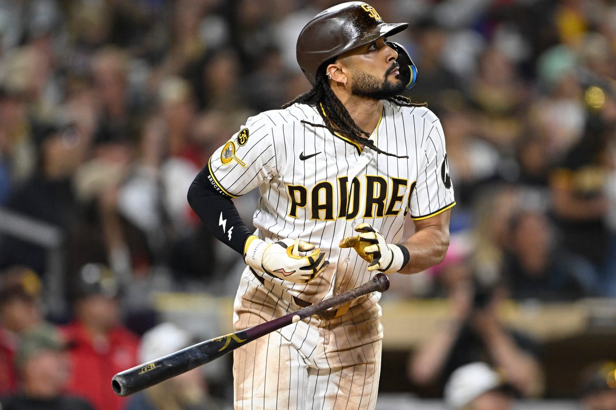Jun 23, 2026; San Diego, California, USA; San Diego Padres right fielder Fernando Tatis Jr. (23) hits a solo home run during the seventh inning against the Atlanta Braves at Petco Park. Mandatory Credit: Denis Poroy-Imagn Images