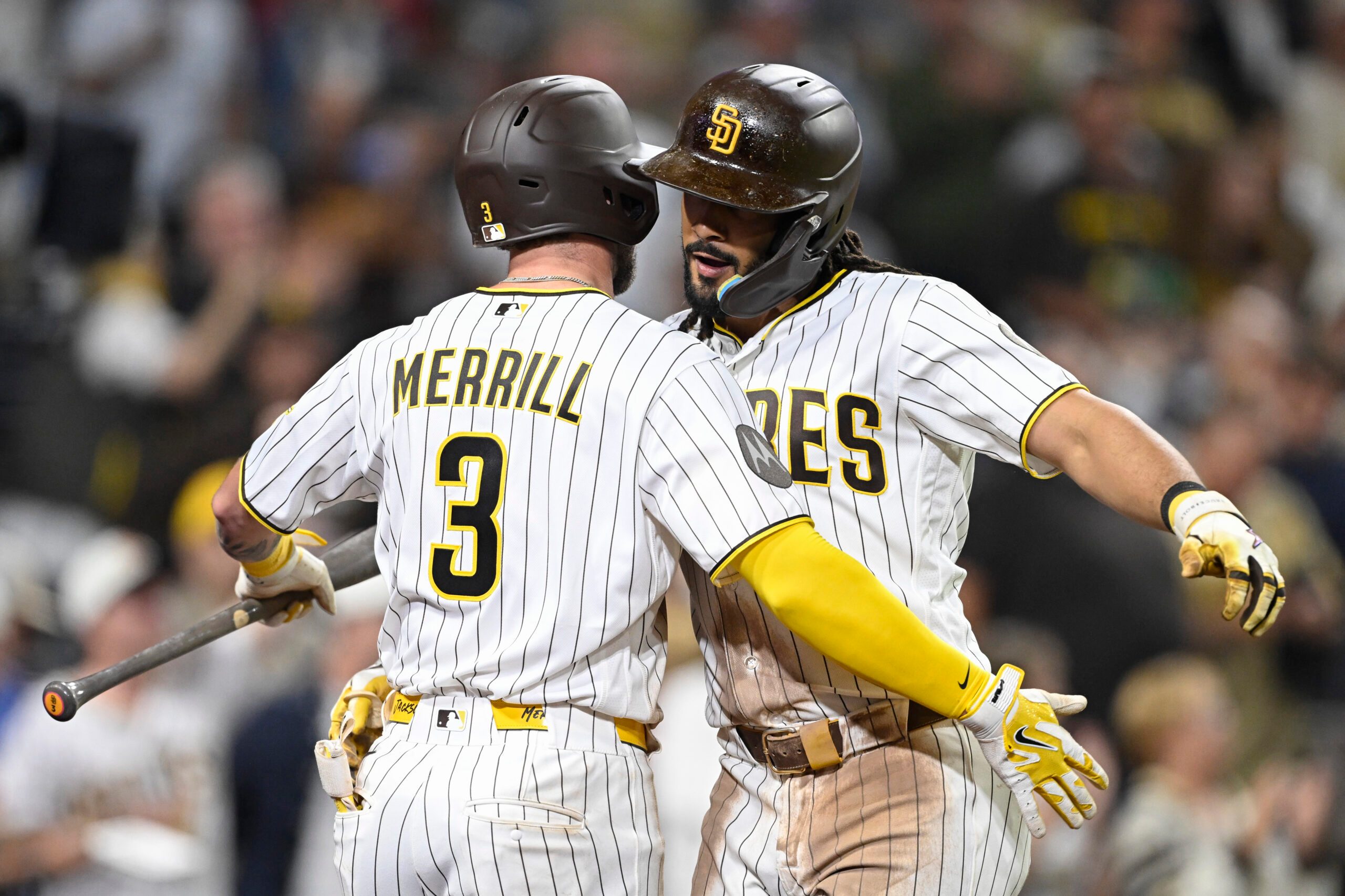 Jun 23, 2026; San Diego, California, USA; San Diego Padres right fielder Fernando Tatis Jr. (23) is congratulated by center fielder Jackson Merrill (3) after hitting a solo home run during the seventh inning against the Atlanta Braves at Petco Park. Mandatory Credit: Denis Poroy-Imagn Images