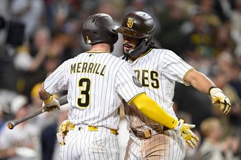 Jun 23, 2026; San Diego, California, USA; San Diego Padres right fielder Fernando Tatis Jr. (23) is congratulated by center fielder Jackson Merrill (3) after hitting a solo home run during the seventh inning against the Atlanta Braves at Petco Park. Mandatory Credit: Denis Poroy-Imagn Images