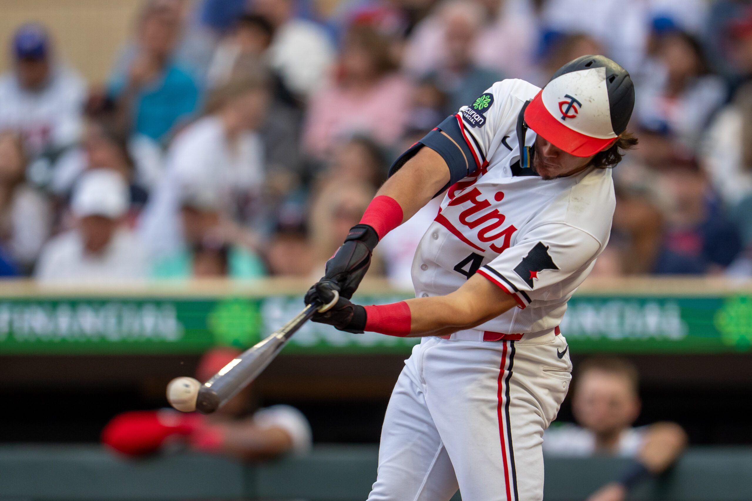 Jun 24, 2026; Minneapolis, Minnesota, USA; Minnesota Twins second baseman Tristan Gray (4) hits a double against the Los Angeles Dodgers in the fourth inning at Target Field. Mandatory Credit: Jesse Johnson-Imagn Images
