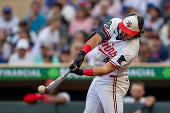 Jun 24, 2026; Minneapolis, Minnesota, USA; Minnesota Twins second baseman Tristan Gray (4) hits a double against the Los Angeles Dodgers in the fourth inning at Target Field. Mandatory Credit: Jesse Johnson-Imagn Images