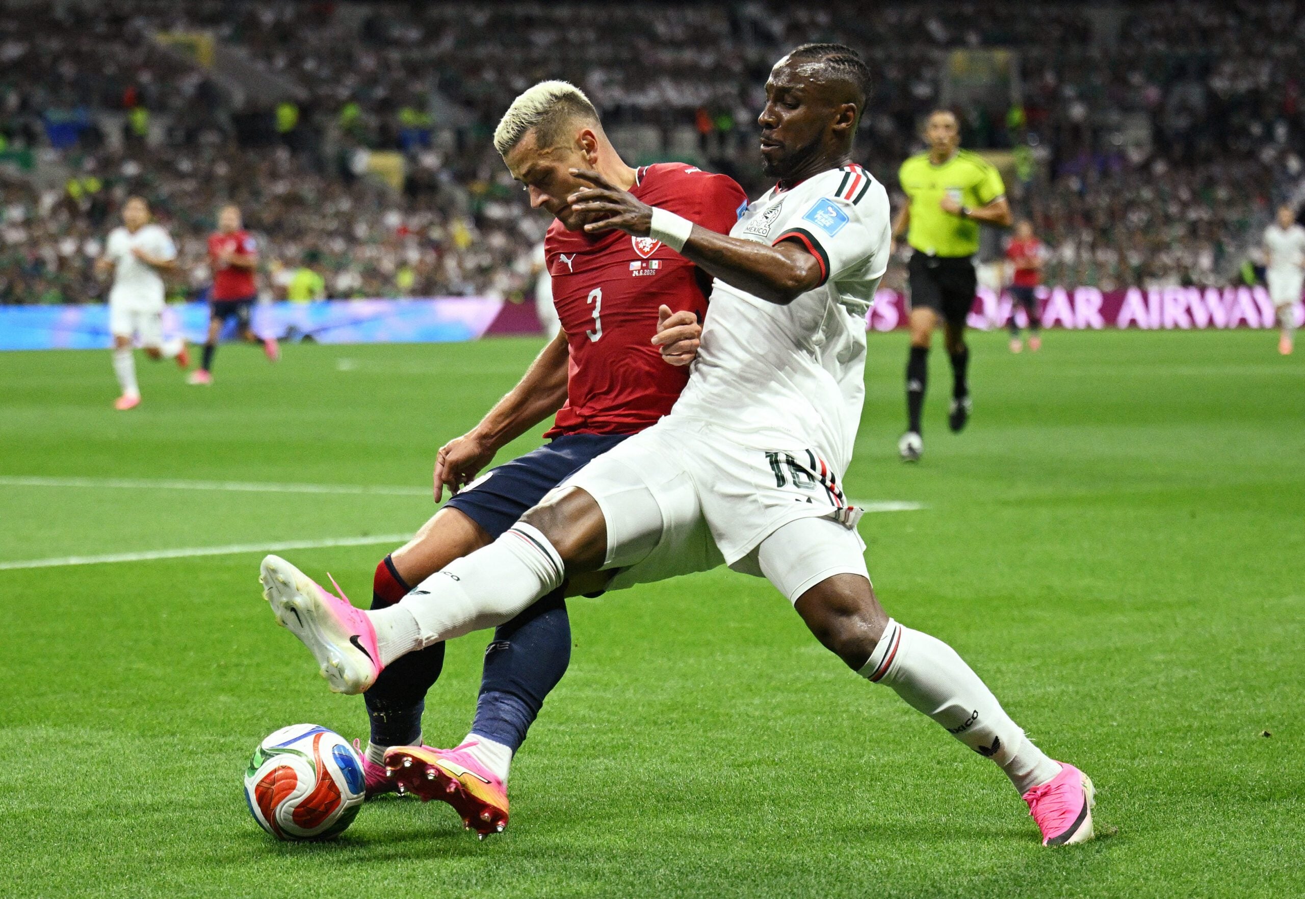 June 24, 2026; Mexico City, Mexico; Mexico's Julian Quinones in action with Czech Republic's Tomas Holes.  Mandatory Credit: Annegret Hilse-Reuters via Imagn Images