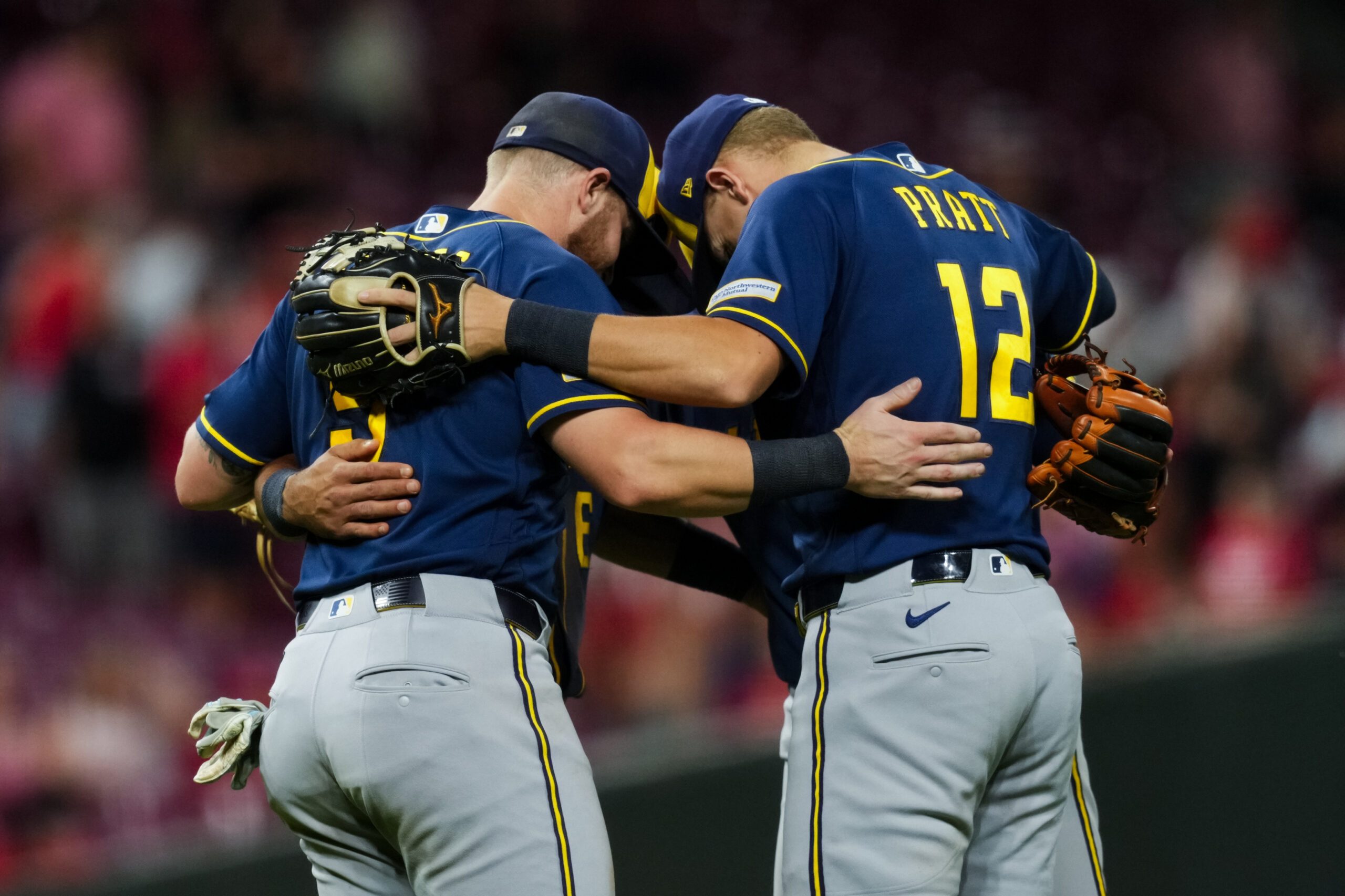 Jun 24, 2026; Cincinnati, Ohio, USA;  Milwaukee Brewers first baseman Jake Bauers (9), third baseman David Hamilton (6), second baseman Brice Turang (2), and shortstop Cooper Pratt (12) celebrate after the final out of the game against the Cincinnati Reds at Great American Ball Park. Mandatory Credit: Aaron Doster-Imagn Images