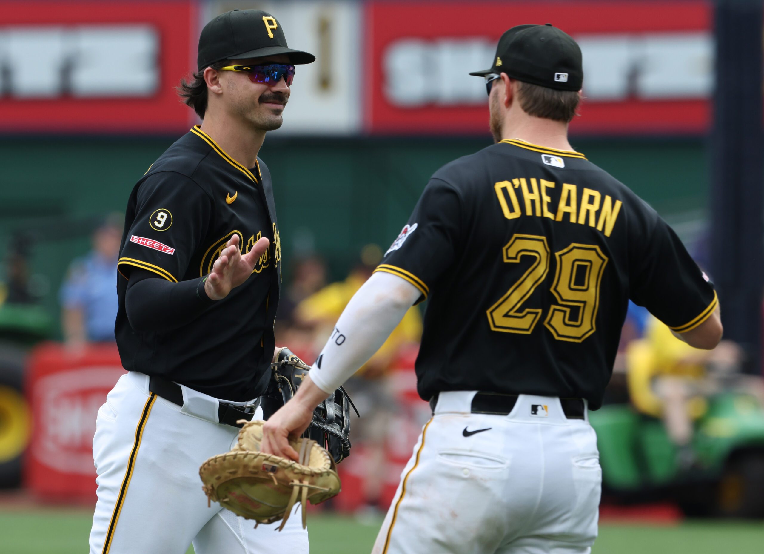 Jun 25, 2026; Pittsburgh, Pennsylvania, USA;  Pittsburgh Pirates left fielder Bryan Reynolds (left) and first baseman Ryan O'Hearn (29) celebrate after defeating the Seattle Mariners at PNC Park. Mandatory Credit: Charles LeClaire-Imagn Images