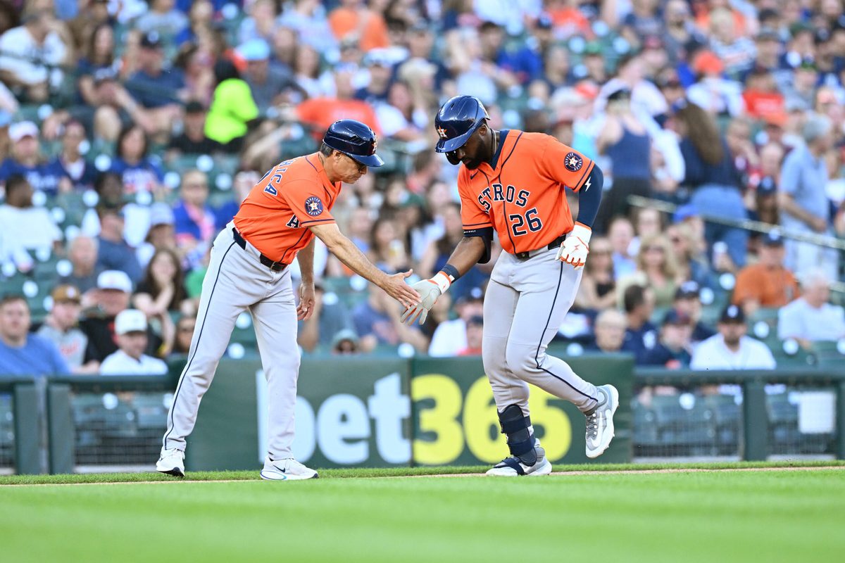 Jun 25, 2026; Detroit, Michigan, USA; Houston Astros center fielder Taylor Trammell (26) celebrates with Houston Astros third base coach Tony Perezchica (12) after hitting a solo home run against the Detroit Tigers in the sixth  inning at Comerica Park. Mandatory Credit: Lon Horwedel-Imagn Images