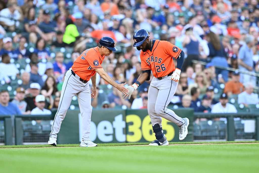 Jun 25, 2026; Detroit, Michigan, USA; Houston Astros center fielder Taylor Trammell (26) celebrates with Houston Astros third base coach Tony Perezchica (12) after hitting a solo home run against the Detroit Tigers in the sixth inning at Comerica Park. Mandatory Credit: Lon Horwedel-Imagn Images