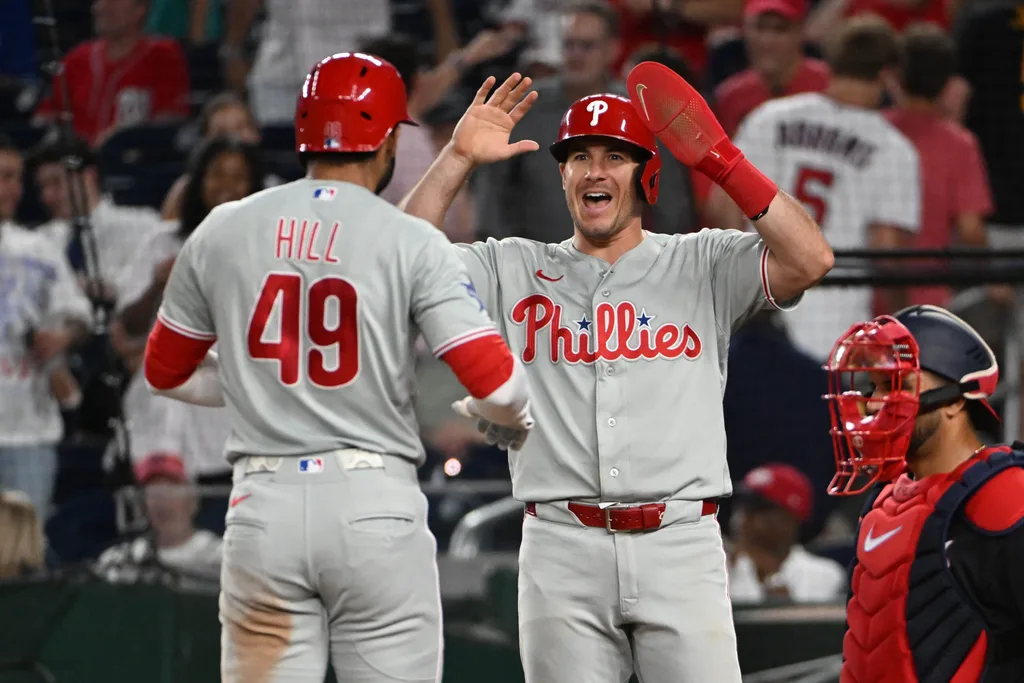 Jun 25, 2026; Washington, District of Columbia, USA; Philadelphia Phillies right fielder Derek Hill (49) is congratulated by catcher J.T. Realmuto (10) after hitting a two run home run against the Washington Nationals during the ninth inning at Nationals Park. Mandatory Credit: Brad Mills-Imagn Images