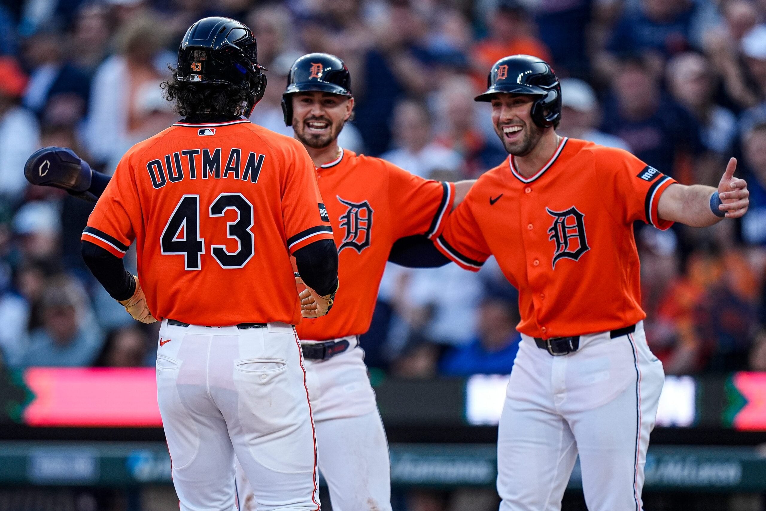 Detroit Tigers center fielder James Outman (43) celebrates batting a three run home run against Houston Astros with second baseman Zach McKinstry (39) and left fielder Matt Vierling (8) during the fourth inning at Comerica Park in Detroit on Friday, June 26, 2026.