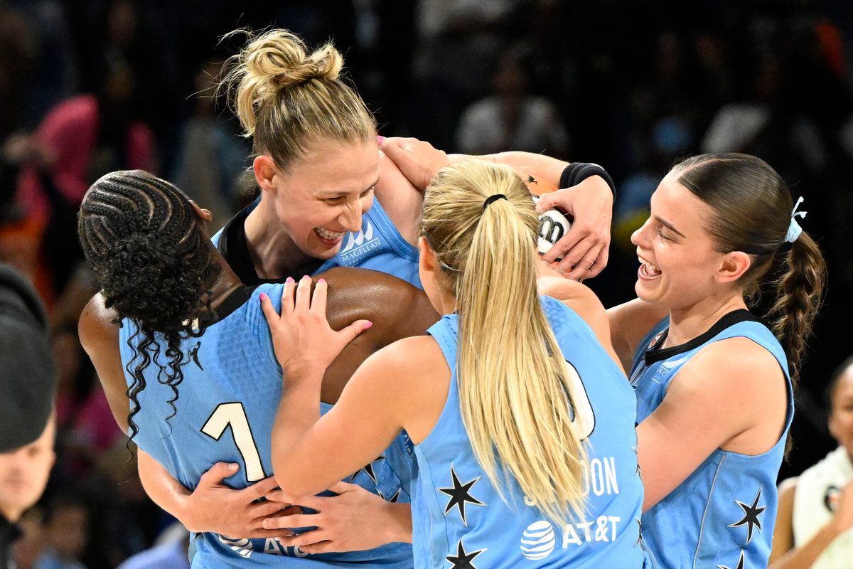 Jun 26, 2026; Chicago, Illinois, USA; Chicago Sky guard Courtney Vandersloot (22), top, celebrates with teammates after the game against the Portland Fire at Wintrust Arena. Mandatory Credit: Matt Marton-Imagn Images