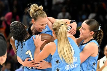 Jun 26, 2026; Chicago, Illinois, USA; Chicago Sky guard Courtney Vandersloot (22), top, celebrates with teammates after the game against the Portland Fire at Wintrust Arena. Mandatory Credit: Matt Marton-Imagn Images