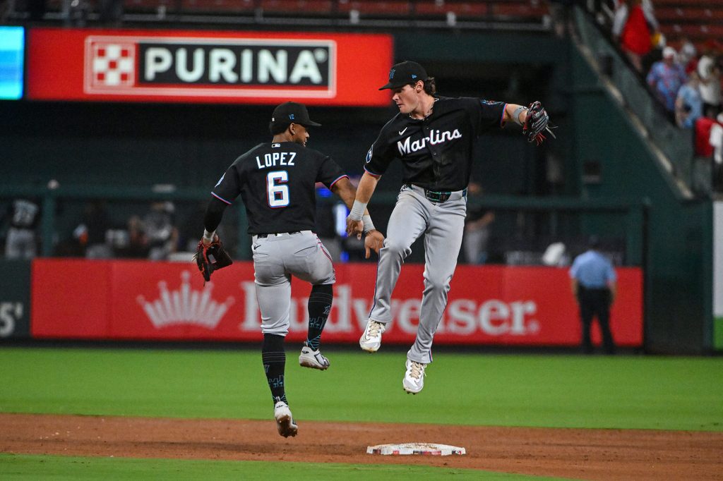 Jun 26, 2026; St. Louis, Missouri, USA; Miami Marlins left fielder Griffin Conine (18) celebrates with shortstop Otto Lopez (6) after the Marlins defeated the St. Louis Cardinals at Busch Stadium. Mandatory Credit: Jeff Curry-Imagn Images