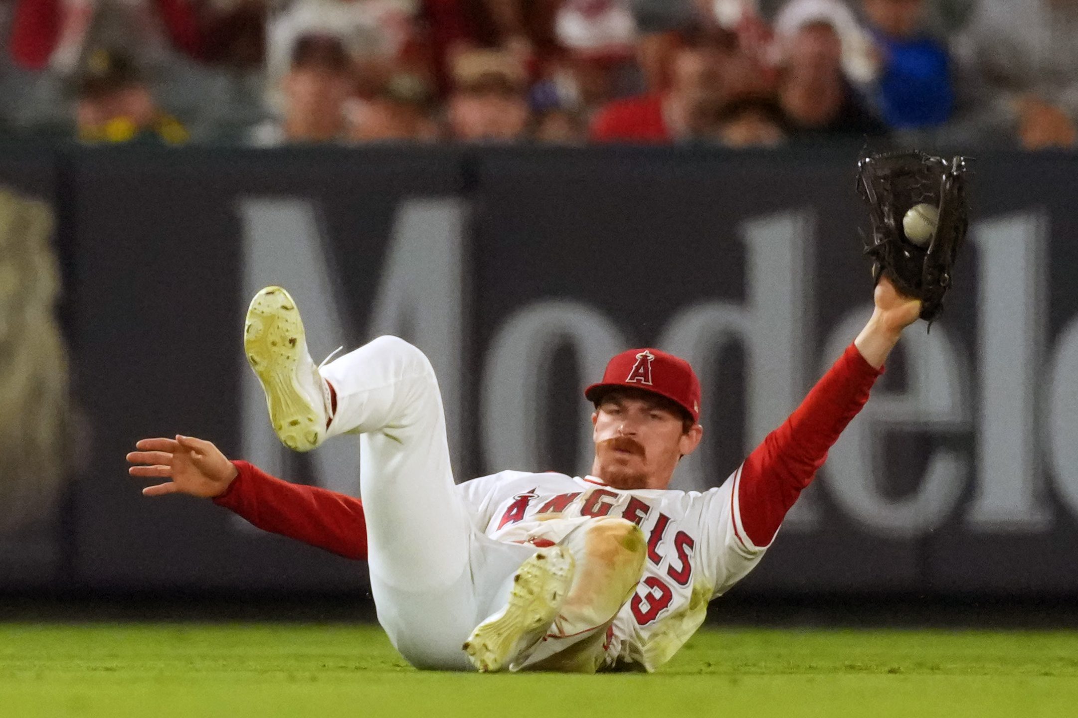 Jun 26, 2026; Anaheim, California, USA; Los Angeles Angels pitcher Chase Silseth (63) catches a fly ball by Athletics shortstop Alika Williams (not pictured) in the eighth inning at Angel Stadium. Mandatory Credit: Kirby Lee-Imagn Images