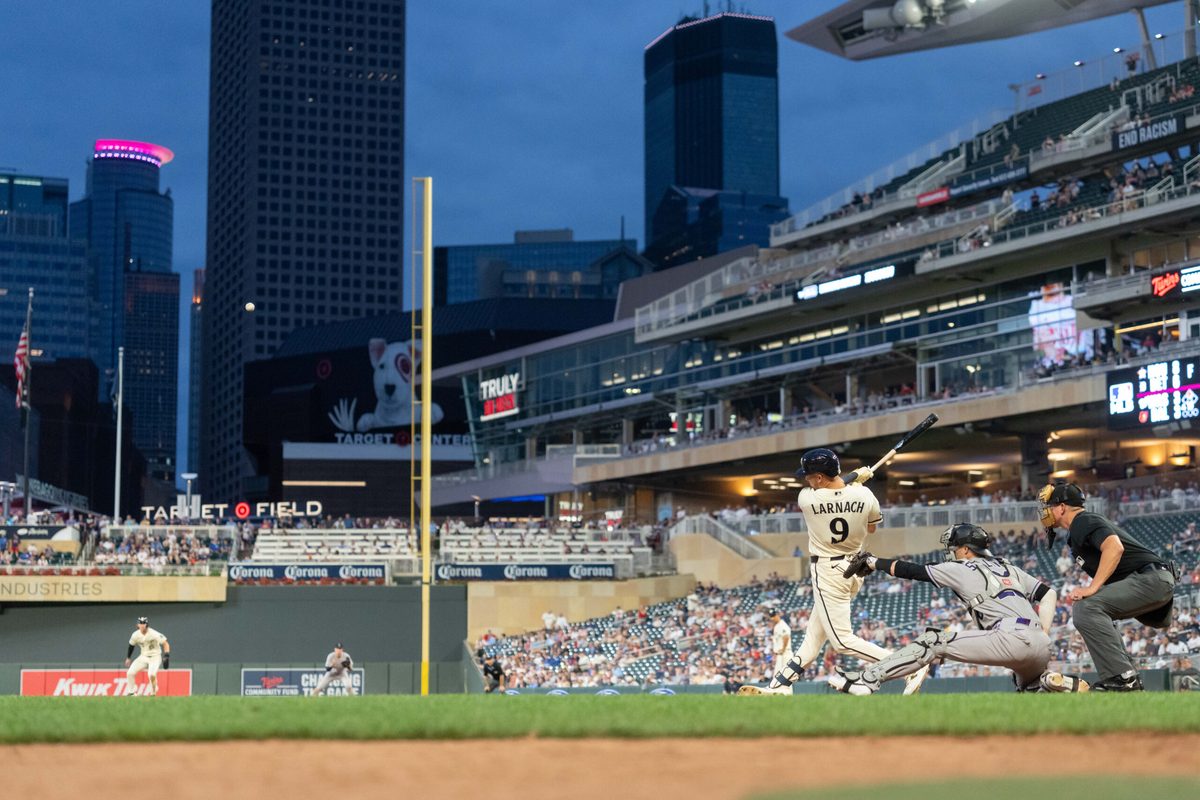 Jun 27, 2026; Minneapolis, Minnesota, USA; Minnesota Twins left fielder Trevor Larnach (9) hits double, scoring three runs in the ninth inning against the Colorado Rockies at Target Field. Mandatory Credit: Matt Blewett-Imagn Images