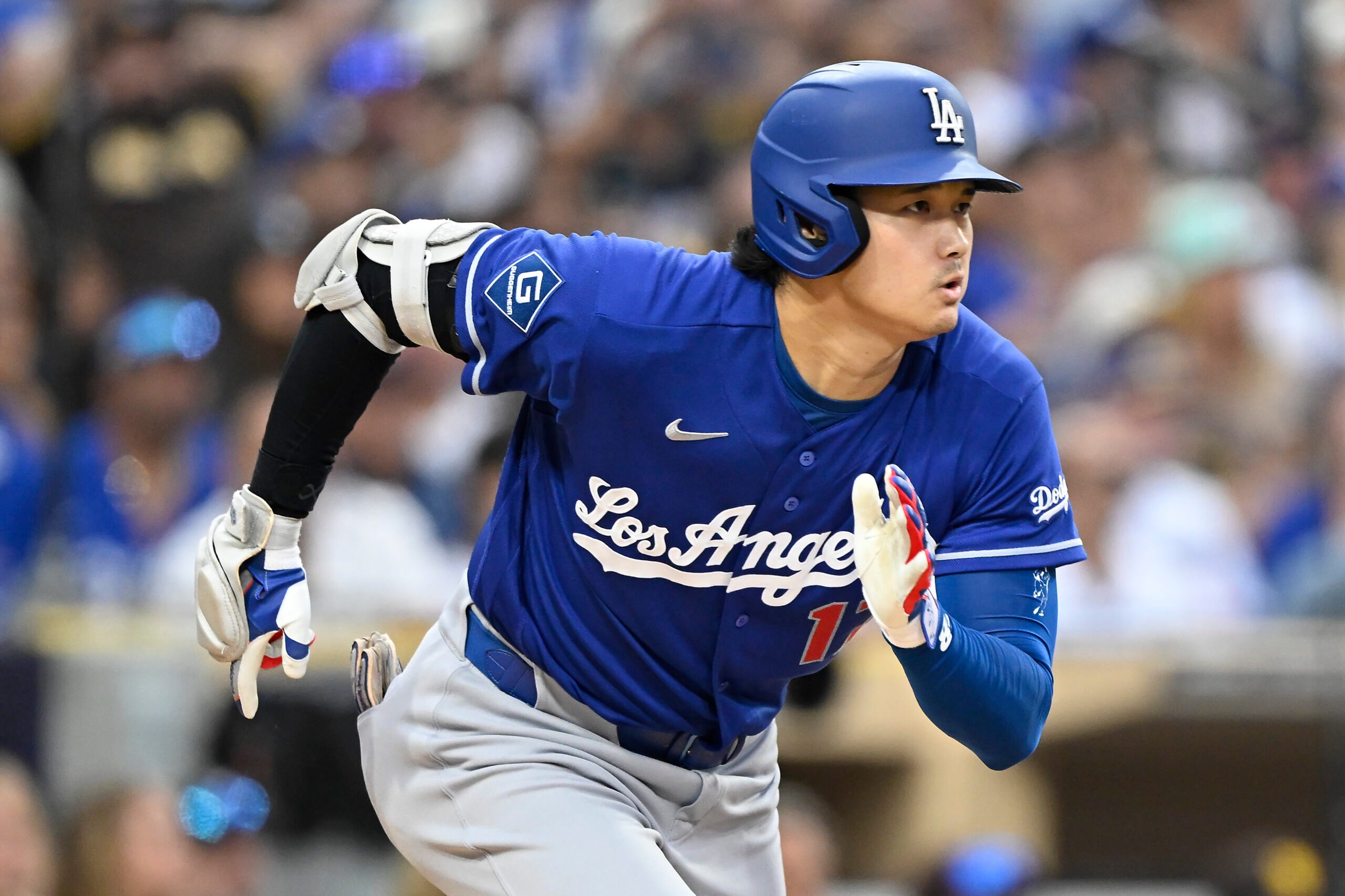 Jun 27, 2026; San Diego, California, USA; Los Angeles Dodgers designated hitter Shohei Ohtani (17) runs after hitting a single during the sixth inning against the San Diego Padres at Petco Park. Mandatory Credit: Denis Poroy-Imagn Images