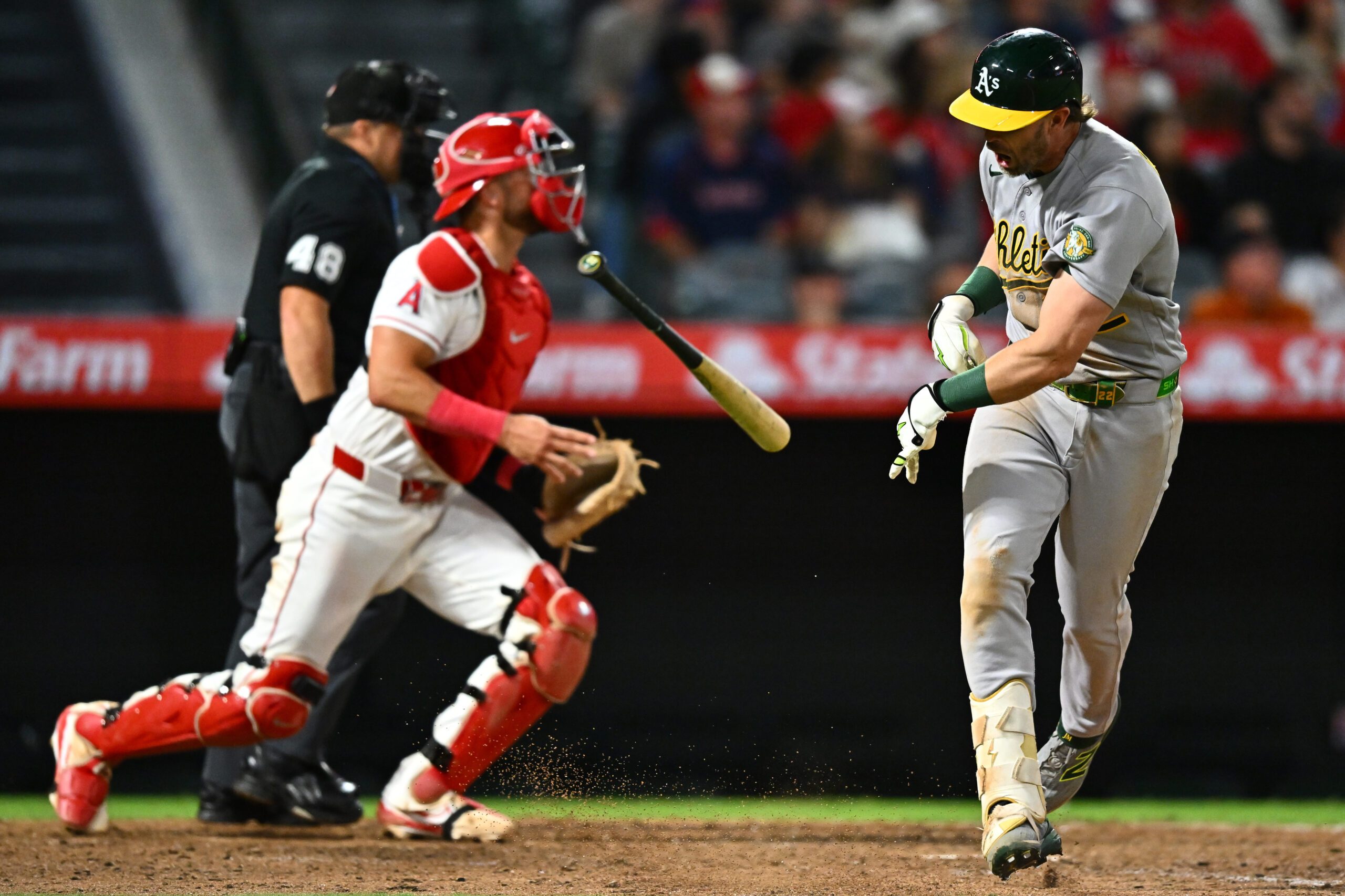Jun 27, 2026; Anaheim, California, USA; Athletics second baseman Jeff McNeil (22) throws his bat after hitting a flyout during the ninth inning against the Los Angeles Angels at Angel Stadium. Mandatory Credit: William Liang-Imagn Images