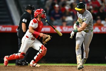 Jun 27, 2026; Anaheim, California, USA; Athletics second baseman Jeff McNeil (22) throws his bat after hitting a flyout during the ninth inning against the Los Angeles Angels at Angel Stadium. Mandatory Credit: William Liang-Imagn Images