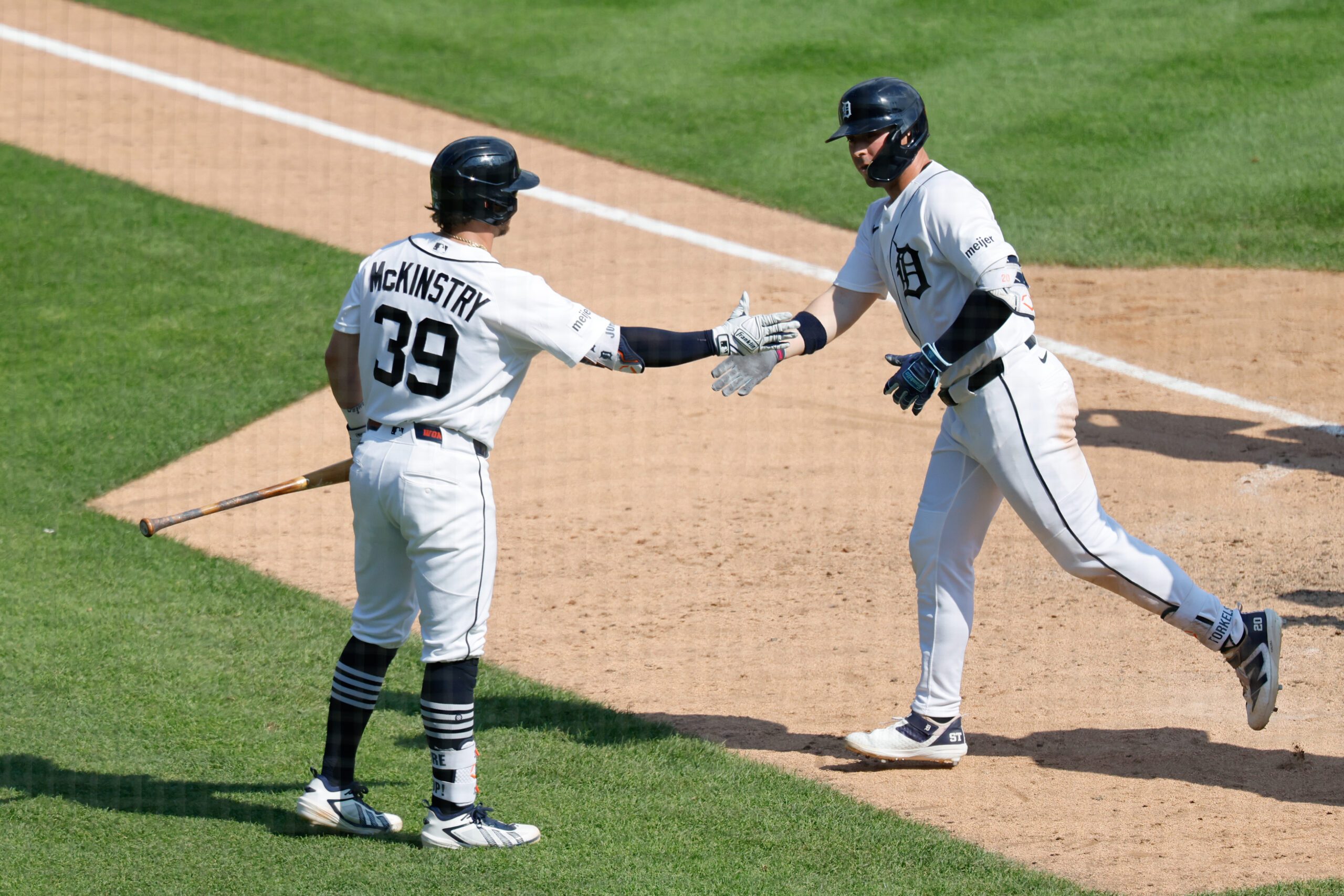 Jun 28, 2026; Detroit, Michigan, USA;  Detroit Tigers first baseman Spencer Torkelson (20) receives congratulations from second baseman Zach McKinstry (39) after he hits a two run home run tenth inning against the Houston Astros at Comerica Park. Mandatory Credit: Rick Osentoski-Imagn Images