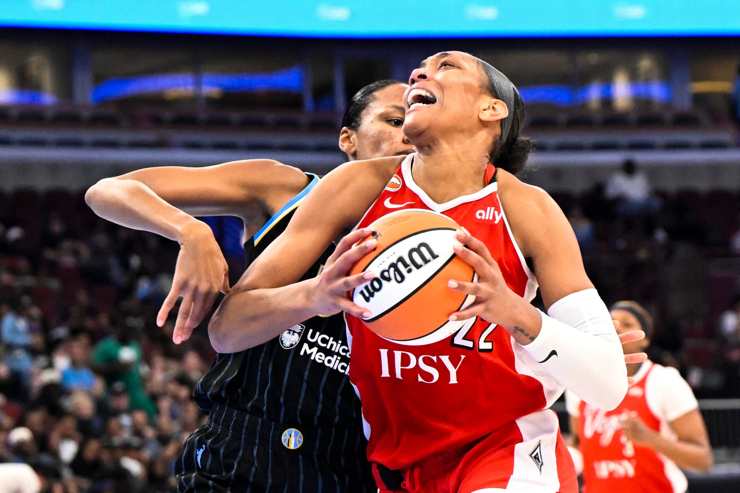 Jun 28, 2026; Chicago, Illinois, USA;  Las Vegas Aces center A'ja Wilson (22) drives to the basket against Chicago Sky forward-center  Azura Stevens (30) during the second half at United Center. Mandatory Credit: Matt Marton-Imagn Images