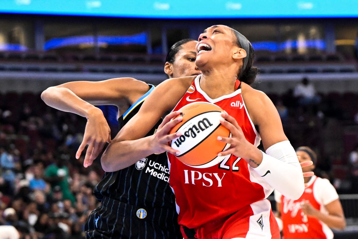 Jun 28, 2026; Chicago, Illinois, USA;  Las Vegas Aces center A'ja Wilson (22) drives to the basket against Chicago Sky forward-center  Azura Stevens (30) during the second half at United Center. Mandatory Credit: Matt Marton-Imagn Images