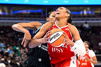 Jun 28, 2026; Chicago, Illinois, USA;  Las Vegas Aces center A'ja Wilson (22) drives to the basket against Chicago Sky forward-center  Azura Stevens (30) during the second half at United Center. Mandatory Credit: Matt Marton-Imagn Images