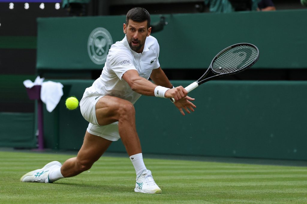 Jun 29, 2026; London, United Kingdom; Novak Djokovic (SRB) reaches for a backhand against Yibing Wu (CHN) (not pictured) on day one of The Championships Wimbledon 2026 at All England Lawn Tennis and Croquet Club. Mandatory Credit: Geoff Burke-Imagn Images
