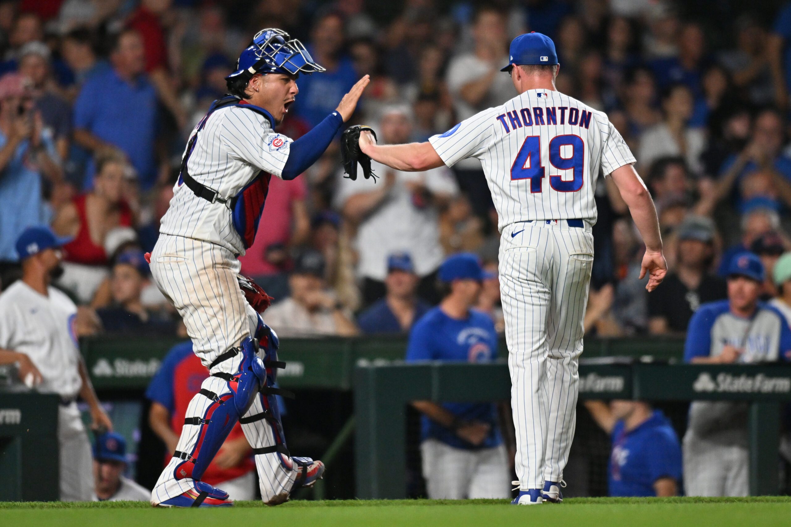 Jun 29, 2026; Chicago, Illinois, USA; Chicago Cubs catcher Miguel Amaya (9) celebrates with pitcher Trent Thornton (49) after ending the top of the ninth inning against the San Diego Padres at Wrigley Field. Mandatory Credit: Patrick Gorski-Imagn Images