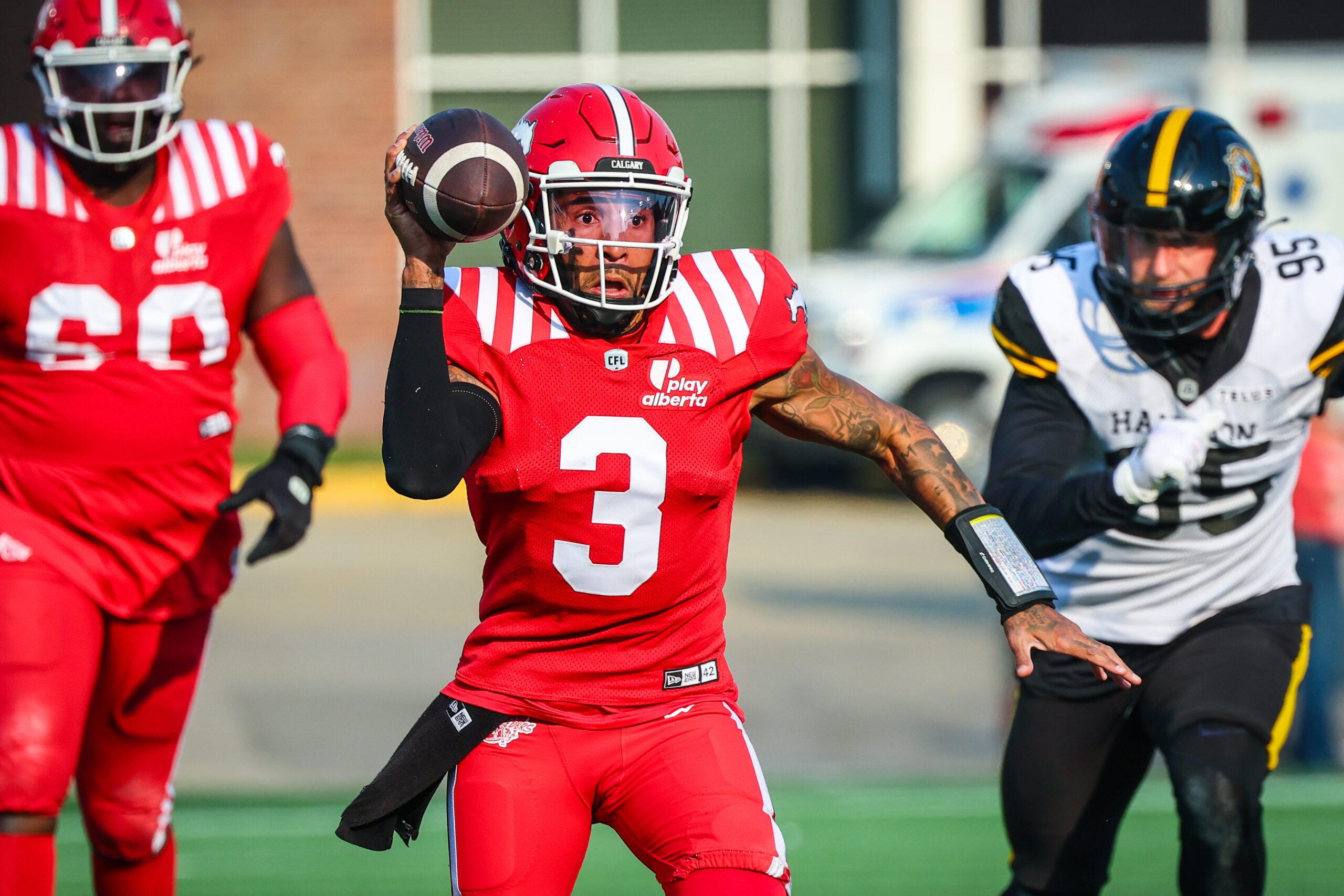 Jun 7, 2025; Calgary, Alberta, Canada; Calgary Stampeders quarterback Vernon Adams Jr (3) looks to pass against the Hamilton Tiger-Cats during the second half at McMahon Stadium. Mandatory Credit: Sergei Belski-Imagn Images