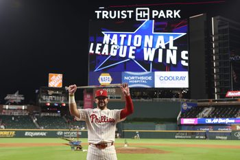 Jul 15, 2025; Cumberland, Georgia, USA; National League designated hitter Kyle Schwarber (12) of the Philadelphia Phillies celebrates after defeating the American League in the 2025 MLB All Star Game at Truist Park. Mandatory Credit: Brett Davis-Imagn Images