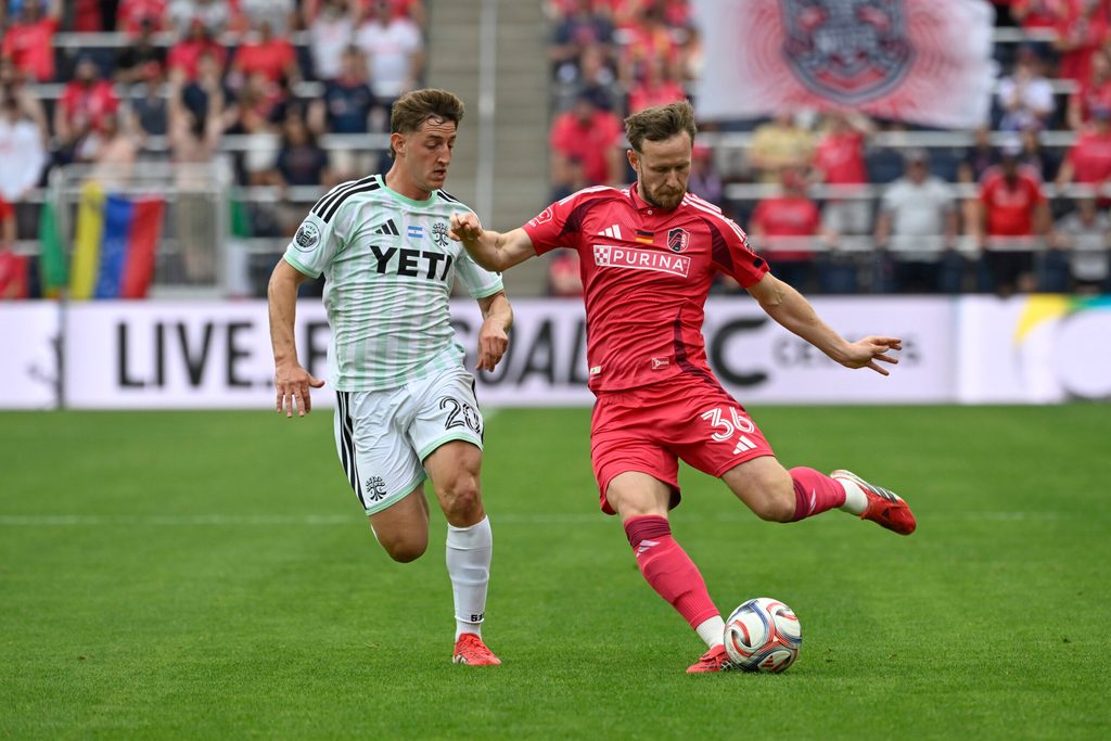 May 23, 2026; St. Louis, Missouri, USA; Austin FC midfielder Nicolas Dubersarsky (20) pressures St. Louis CITY SC forward Cedric Teuchert (36) in the second half at Energizer Park. Mandatory Credit: Joe Puetz-Imagn Images