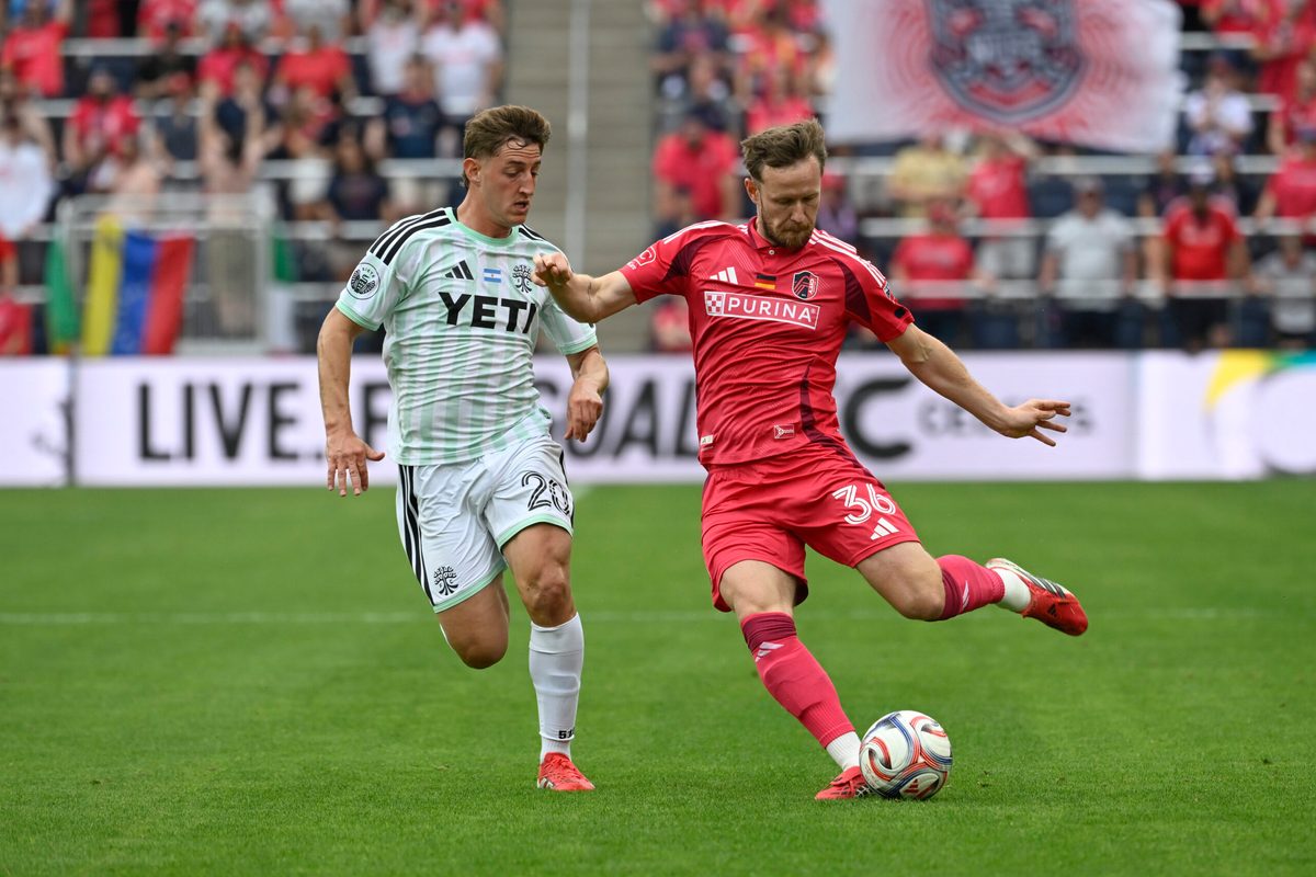May 23, 2026; St. Louis, Missouri, USA; Austin FC midfielder Nicolas Dubersarsky (20) pressures St. Louis CITY SC forward Cedric Teuchert (36) in the second half at Energizer Park. Mandatory Credit: Joe Puetz-Imagn Images