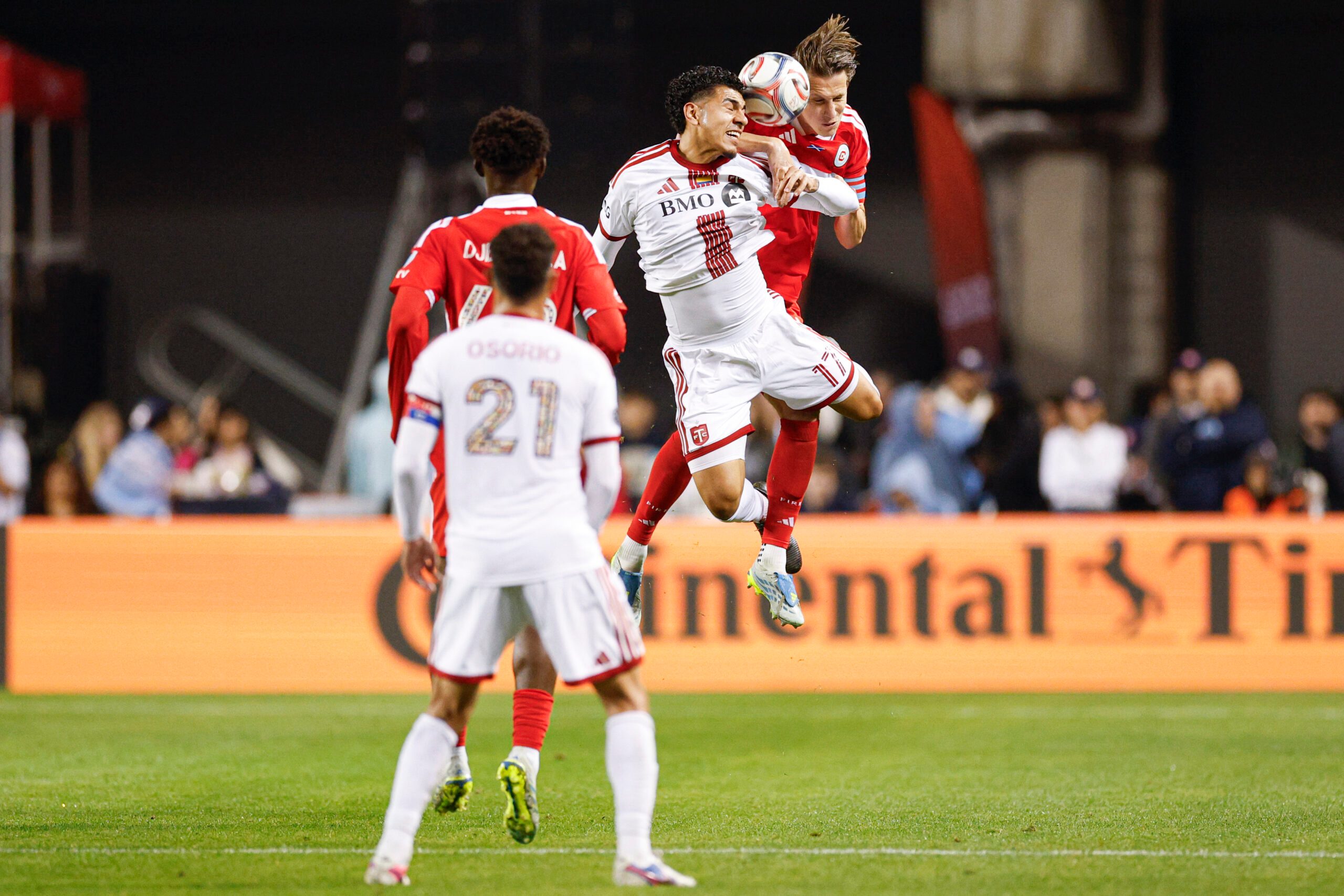 May 23, 2026; Chicago, Illinois, USA; Toronto FC forward Emilio Aristizábal (17) battles for the ball with Chicago Fire FC defender Jack Elliott (3) during the second half at Soldier Field. Mandatory Credit: Kamil Krzaczynski-Imagn Images