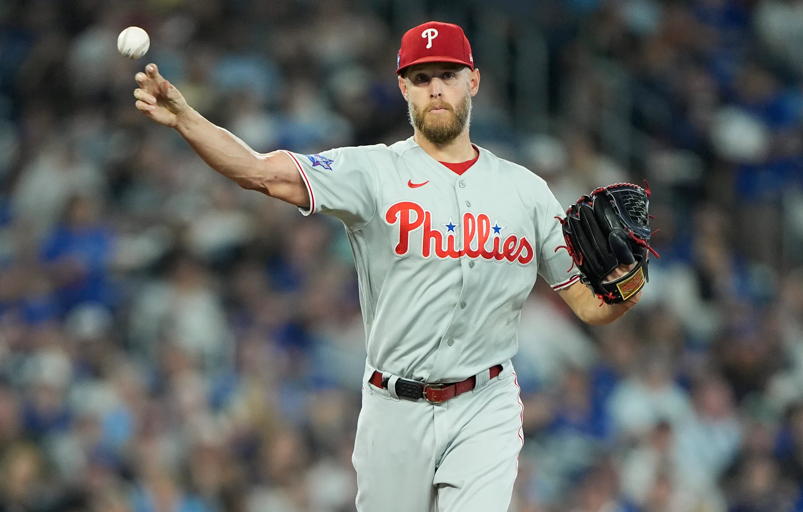 Jun 9, 2026; Toronto, Ontario, CAN; Philadelphia Phillies starting pitcher Zack Wheeler (45) throws to first base to try get out Toronto Blue Jays designated hitter Vladimir Guerrero Jr. (not pictured) during the third inning at Rogers Centre. Mandatory Credit: John E. Sokolowski-Imagn Images