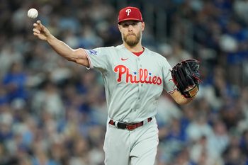 Jun 9, 2026; Toronto, Ontario, CAN; Philadelphia Phillies starting pitcher Zack Wheeler (45) throws to first base to try get out Toronto Blue Jays designated hitter Vladimir Guerrero Jr. (not pictured) during the third inning at Rogers Centre. Mandatory Credit: John E. Sokolowski-Imagn Images