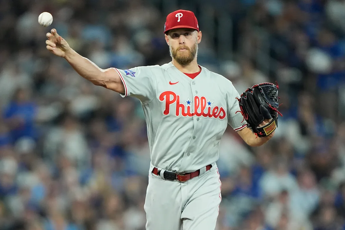 Jun 9, 2026; Toronto, Ontario, CAN; Philadelphia Phillies starting pitcher Zack Wheeler (45) throws to first base to try get out Toronto Blue Jays designated hitter Vladimir Guerrero Jr. (not pictured) during the third inning at Rogers Centre. Mandatory Credit: John E. Sokolowski-Imagn Images