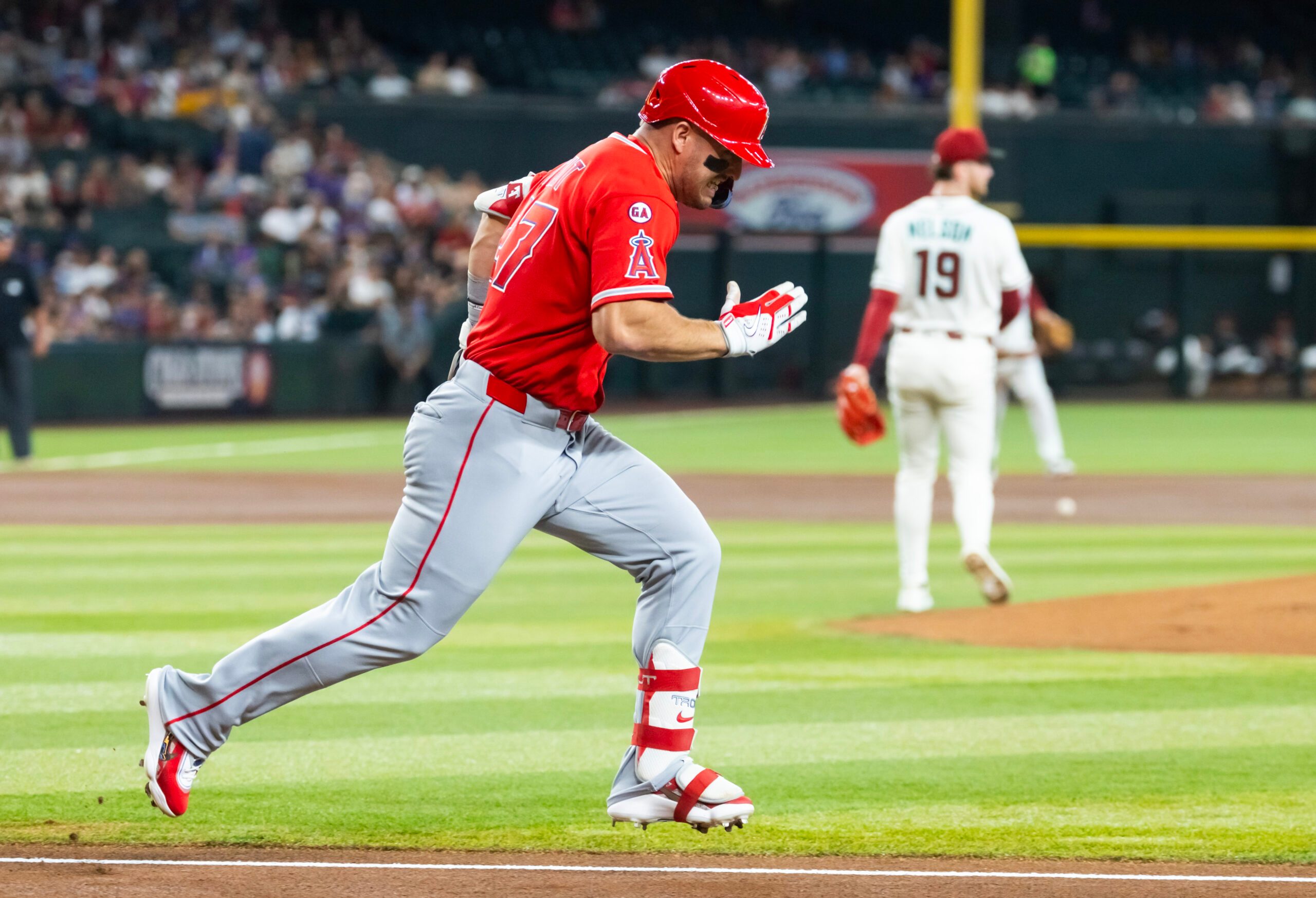 Jun 15, 2026; Phoenix, Arizona, USA; Los Angeles Angels outfielder Mike Trout runs to first base against the Arizona Diamondbacks at Chase Field. Mandatory Credit: Mark J. Rebilas-Imagn Images