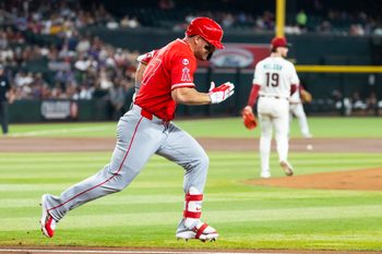 Jun 15, 2026; Phoenix, Arizona, USA; Los Angeles Angels outfielder Mike Trout runs to first base against the Arizona Diamondbacks at Chase Field. Mandatory Credit: Mark J. Rebilas-Imagn Images