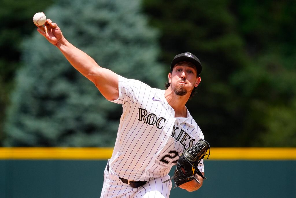 Jun 21, 2026; Denver, Colorado, USA; Colorado Rockies starting pitcher Michael Lorenzen (24) delivers a pitch in the first inning against the Pittsburgh Pirates at Coors Field. Mandatory Credit: Ron Chenoy-Imagn Images