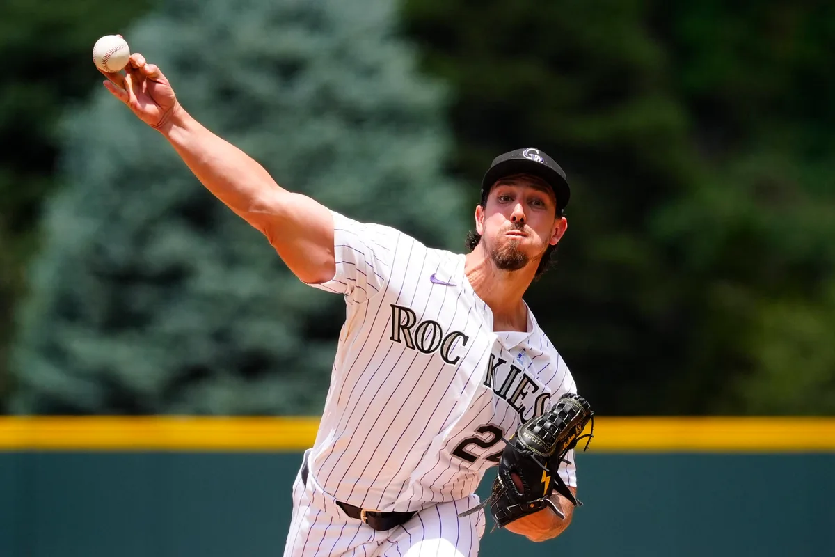Jun 21, 2026; Denver, Colorado, USA; Colorado Rockies starting pitcher Michael Lorenzen (24) delivers a pitch in the first inning against the Pittsburgh Pirates at Coors Field. Mandatory Credit: Ron Chenoy-Imagn Images