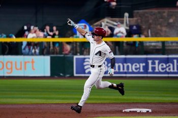 Diamondbacks outfielder Corbin Carroll (7) rounds second after hitting a grand-slam against the Angels during a game at Chase Field in Phoenix on June 17, 2026.