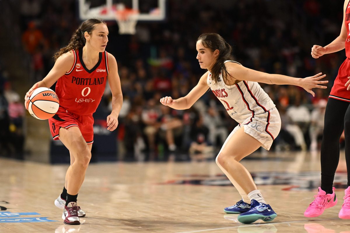 Jun 28, 2026; Washington, District of Columbia, USA; Portland Fire guard Carla Leite (0) dribbles. The ball in front of Washington Mystics guard Sonia Citron (22) during the fourth quarter at CareFirst Arena. Mandatory Credit: Rafael Suanes-Imagn Images