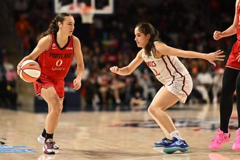 Jun 28, 2026; Washington, District of Columbia, USA; Portland Fire guard Carla Leite (0) dribbles. The ball in front of Washington Mystics guard Sonia Citron (22) during the fourth quarter at CareFirst Arena. Mandatory Credit: Rafael Suanes-Imagn Images