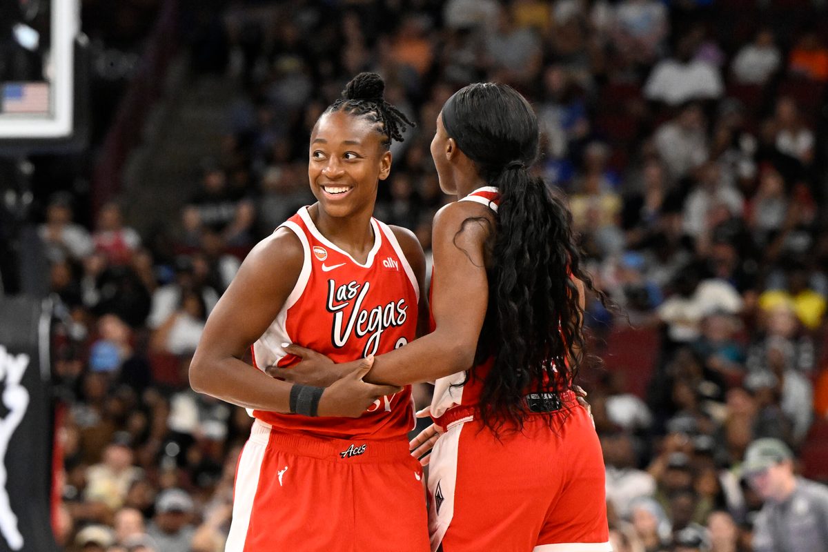Jun 28, 2026; Chicago, Illinois, USA;  Las Vegas Aces guard Jewell Loyd (24) celebrates with guard Jackie Young (0) after she shoots a three-point basket against the Chicago Sky during the second half at United Center. Mandatory Credit: Matt Marton-Imagn Images