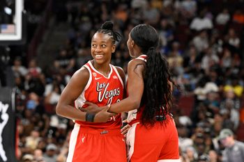 Jun 28, 2026; Chicago, Illinois, USA;  Las Vegas Aces guard Jewell Loyd (24) celebrates with guard Jackie Young (0) after she shoots a three-point basket against the Chicago Sky during the second half at United Center. Mandatory Credit: Matt Marton-Imagn Images